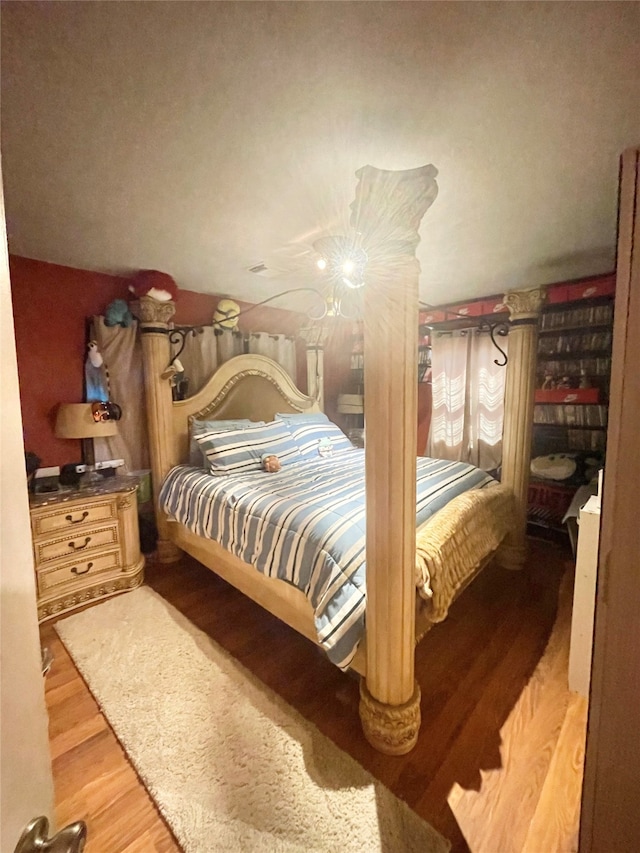 bedroom with hardwood / wood-style flooring