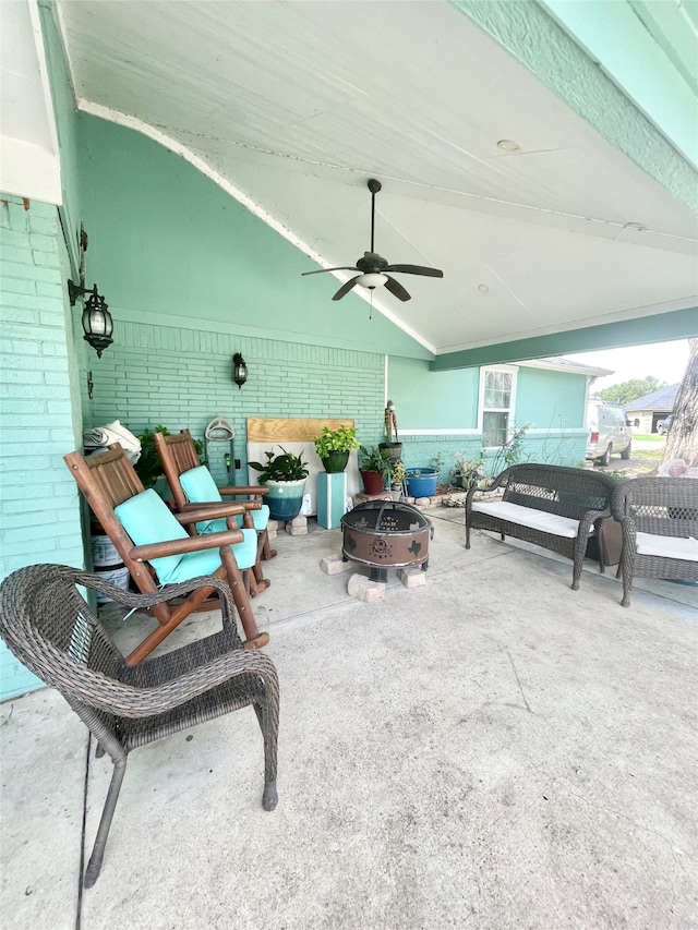 view of patio / terrace featuring a fire pit and ceiling fan