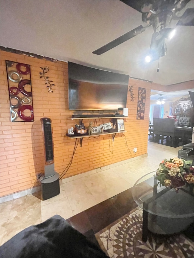 living room with tile patterned floors and brick wall