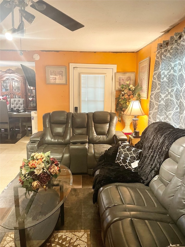 living room with ceiling fan and light tile patterned floors