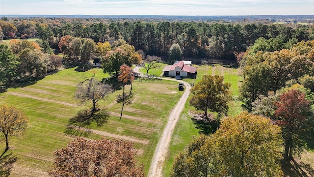 bird's eye view with a view of trees and a rural view