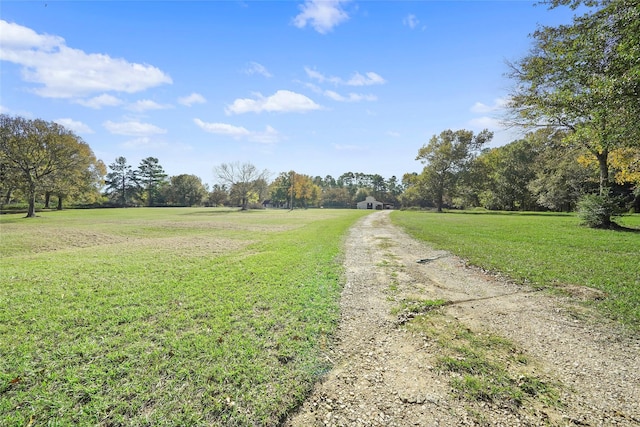 view of street featuring driveway and a rural view