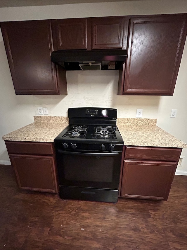 kitchen with dark wood-type flooring, black range with gas stovetop, and dark brown cabinetry