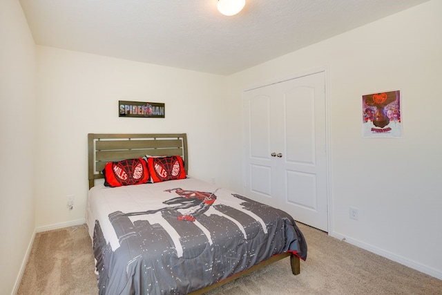 bedroom featuring light carpet