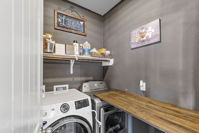 laundry room featuring washing machine and dryer