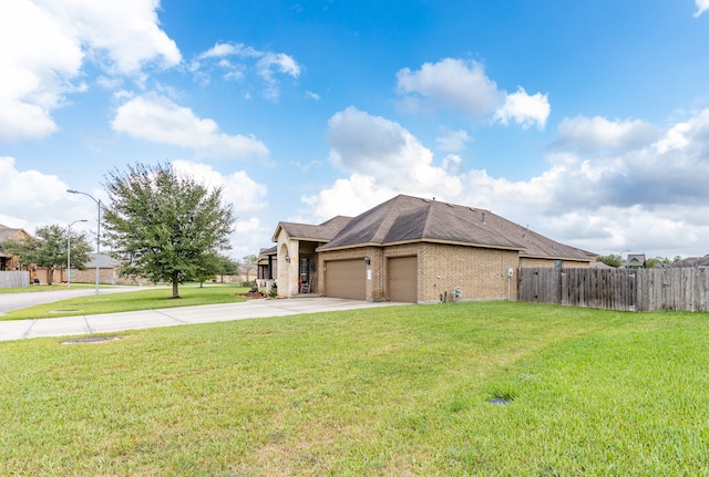 view of home's exterior with a lawn and a garage