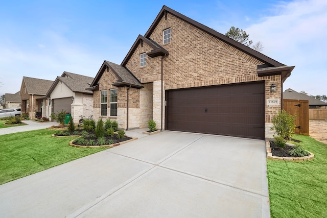 view of front facade featuring a garage and a front yard