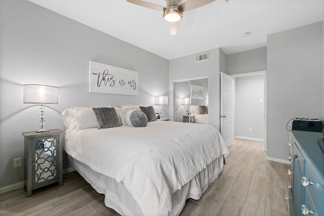 bedroom featuring hardwood / wood-style floors and ceiling fan