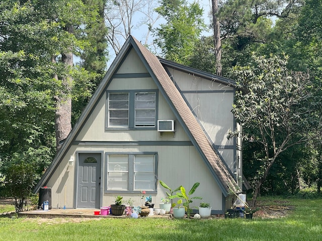 view of front facade with a wall mounted air conditioner