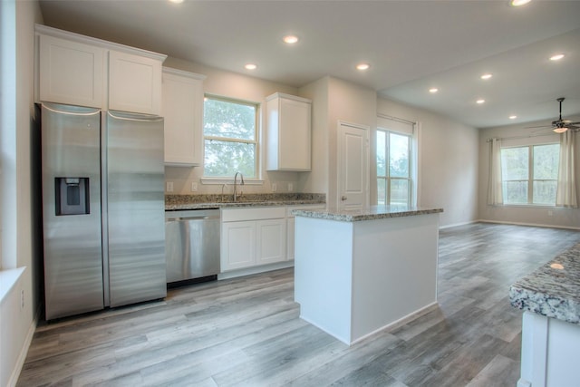 4 Big Lake Cir, Huntsville, TX 77320 - kitchen with appliances with stainless steel finishes, a ceiling fan, white cabinetry, a sink, and recessed lighting