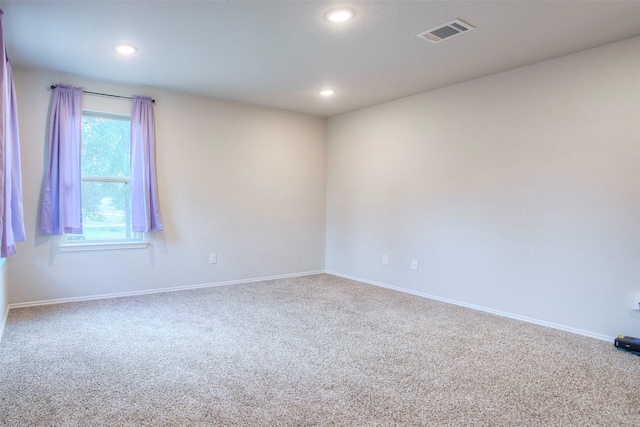 unfurnished room featuring carpet