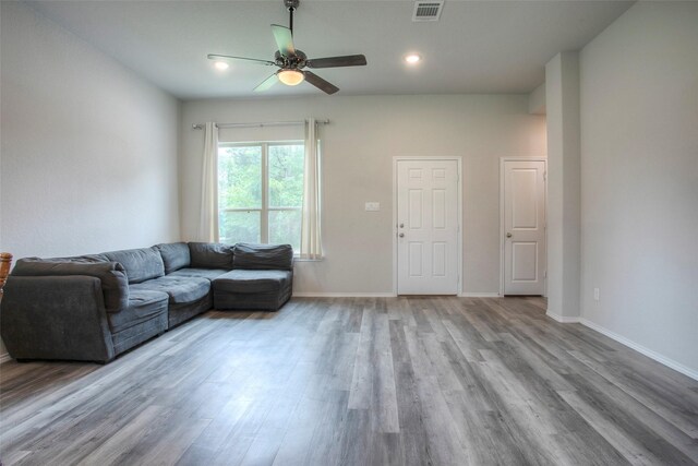 4 Big Lake Cir, Huntsville, TX 77320 - living area with wood finished floors, a ceiling fan, baseboards, and recessed lighting