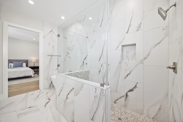 bathroom with a tile shower