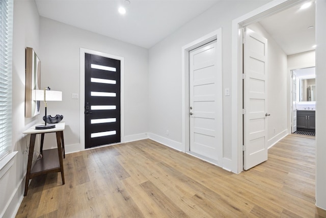 foyer with light hardwood / wood-style floors