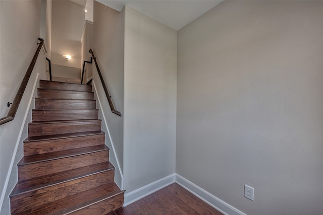 stairway featuring hardwood / wood-style flooring