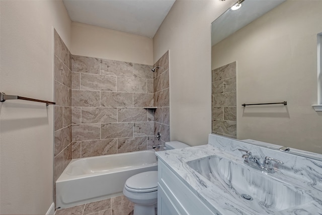 full bathroom featuring toilet, vanity, and tiled shower / bath