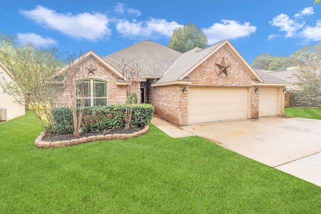 view of front of home with a front lawn, central air condition unit, and a garage