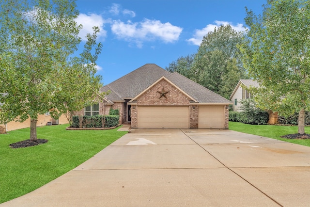 view of front of property featuring a garage and a front yard