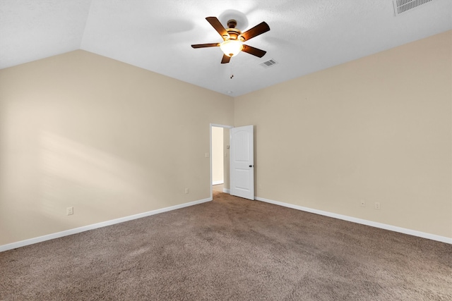 carpeted empty room featuring lofted ceiling and ceiling fan