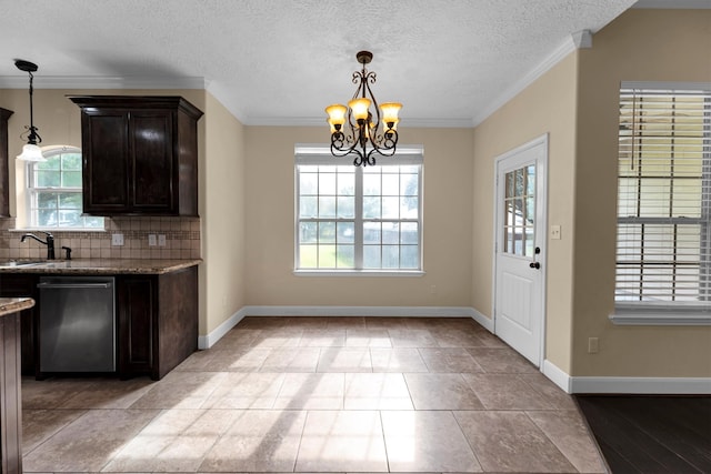 kitchen with dishwasher, decorative backsplash, hanging light fixtures, a chandelier, and ornamental molding