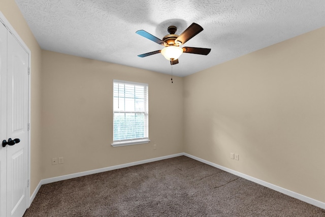 unfurnished room featuring carpet flooring, a textured ceiling, and ceiling fan