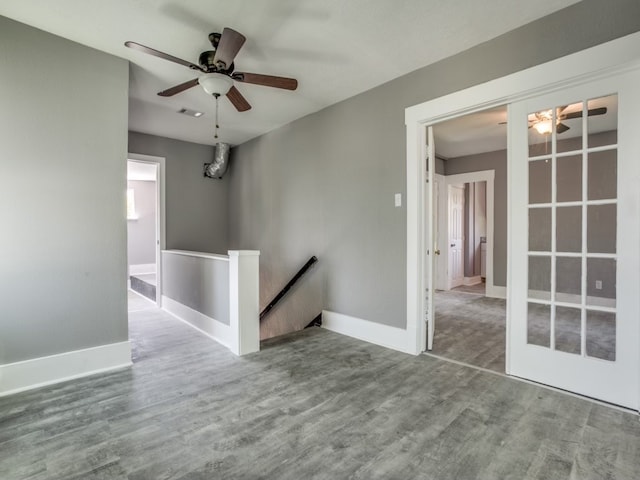 spare room featuring hardwood / wood-style floors and ceiling fan