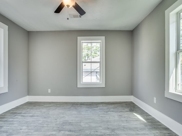 spare room with ceiling fan and light hardwood / wood-style floors