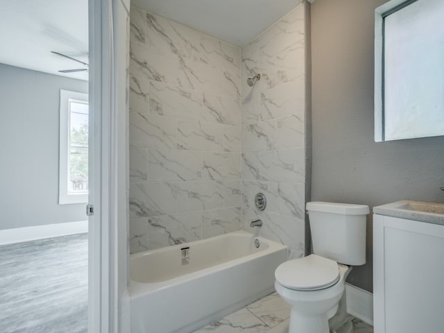 full bathroom with vanity, toilet, and tiled shower / bath combo