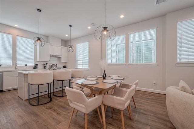 dining area featuring light hardwood / wood-style flooring and sink