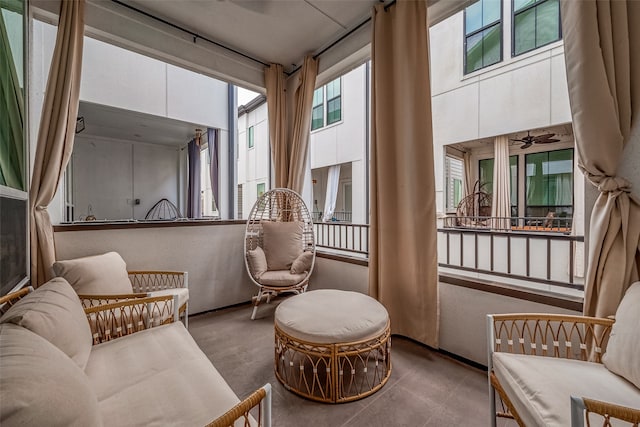 sitting room featuring ceiling fan