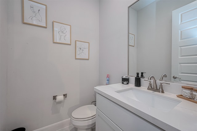 bathroom with tile patterned floors, vanity, and toilet