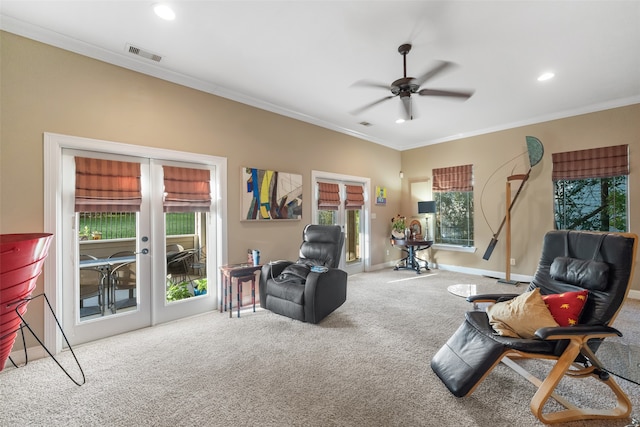 living room with carpet flooring, crown molding, french doors, and ceiling fan