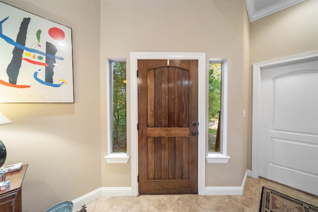 foyer with light tile patterned floors