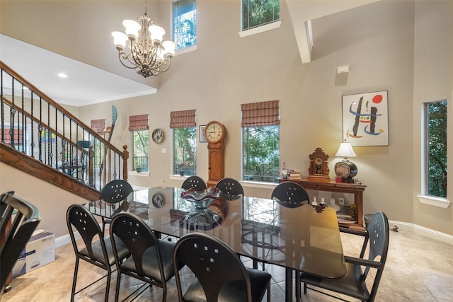 tiled dining space with a high ceiling and a notable chandelier