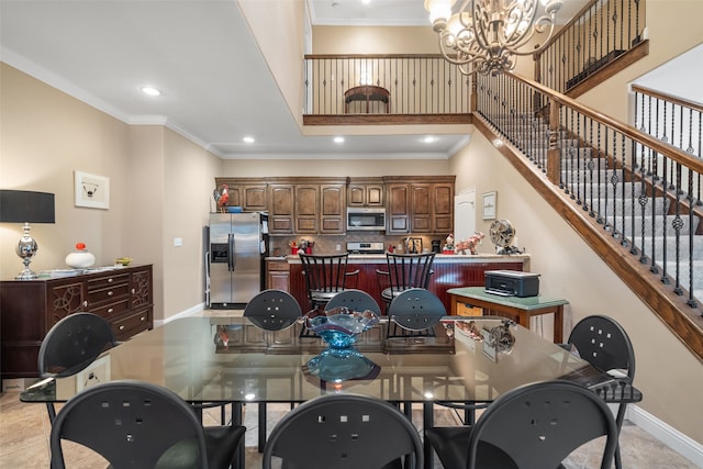 dining space featuring a notable chandelier and ornamental molding