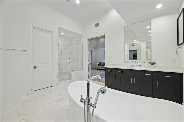 bathroom featuring ornamental molding, shower with separate bathtub, and vanity