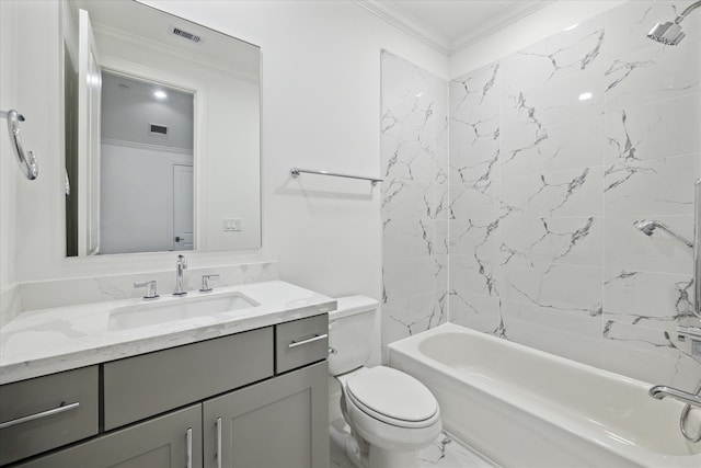 full bathroom featuring vanity, tiled shower / bath, toilet, and crown molding