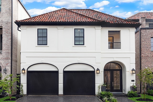 mediterranean / spanish house with a garage