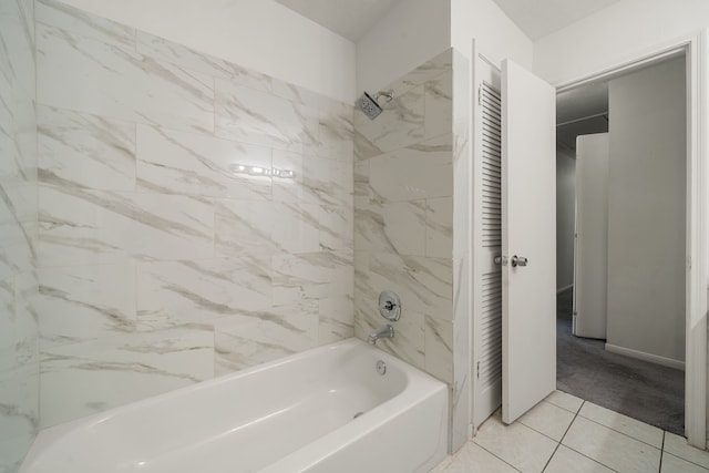 bathroom with tile patterned floors and tiled shower / bath