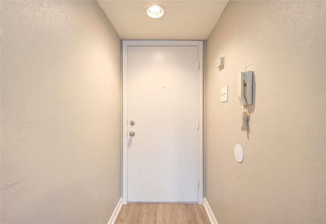 doorway to outside with light hardwood / wood-style flooring