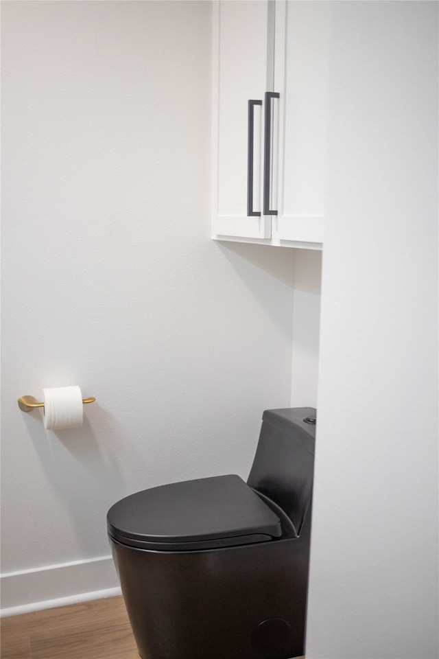 bathroom with wood-type flooring