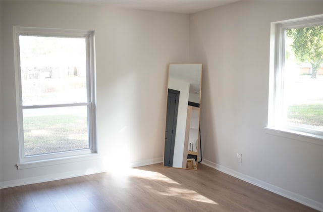 unfurnished room with light hardwood / wood-style floors