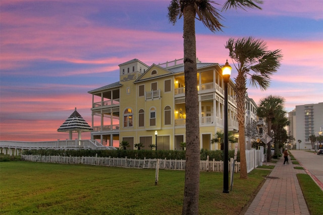 view of outdoor building at dusk