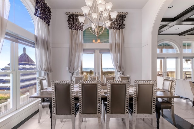 dining room featuring beamed ceiling, a notable chandelier, light tile patterned floors, and coffered ceiling