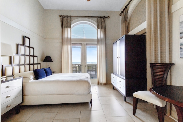 tiled bedroom with access to exterior and french doors