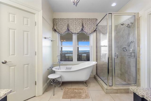 bathroom with tile patterned flooring, vanity, and shower with separate bathtub