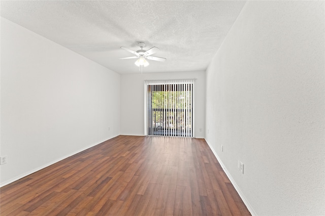 empty room featuring hardwood / wood-style floors, ceiling fan, and a textured ceiling