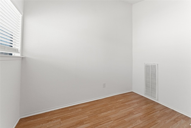 spare room with light hardwood / wood-style flooring