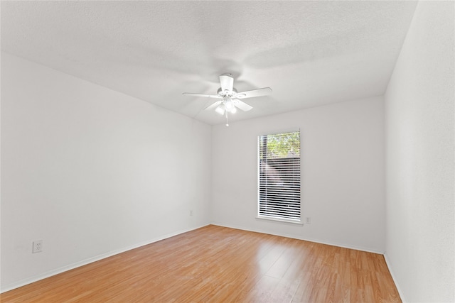 unfurnished room featuring hardwood / wood-style floors, a textured ceiling, and ceiling fan