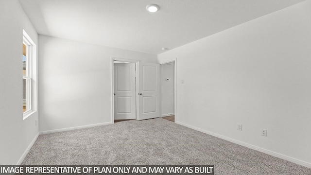 unfurnished bedroom with carpet floors